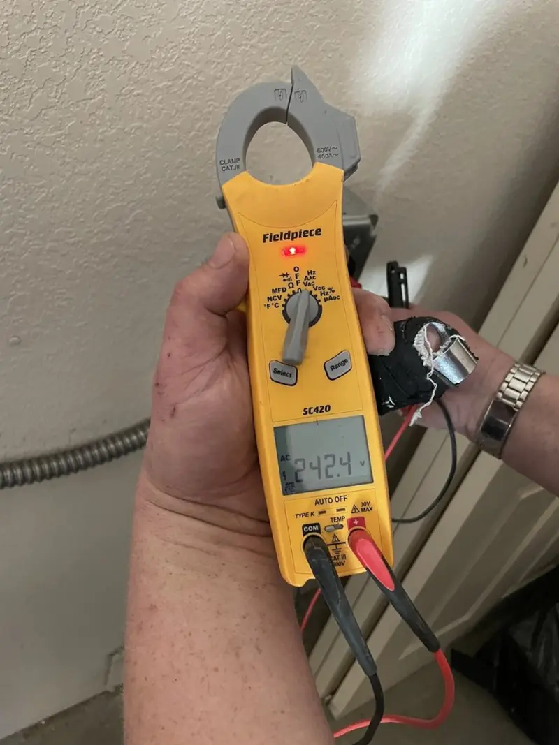Voltage testing with clamp meter during Recessed Lighting Installation in Kimberly
